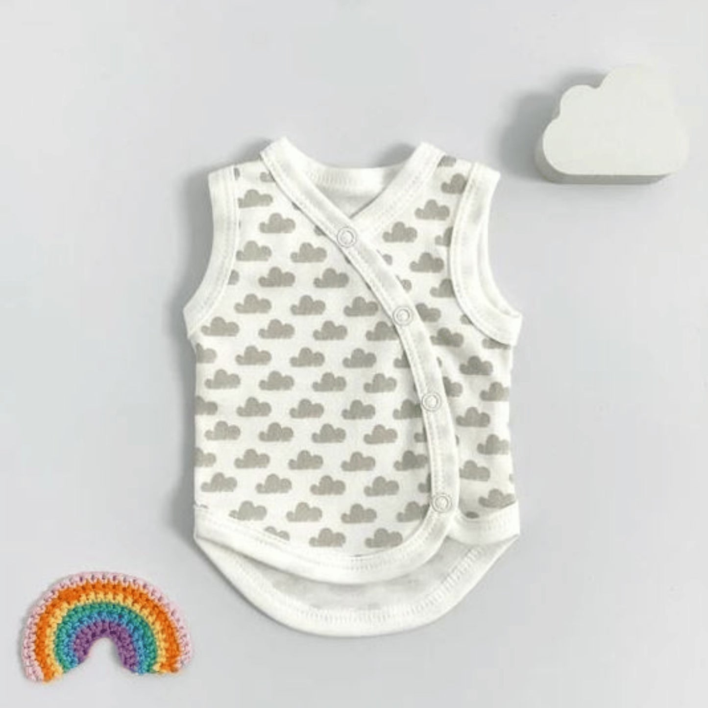A premature baby incubator vest with a silver cloud pattern