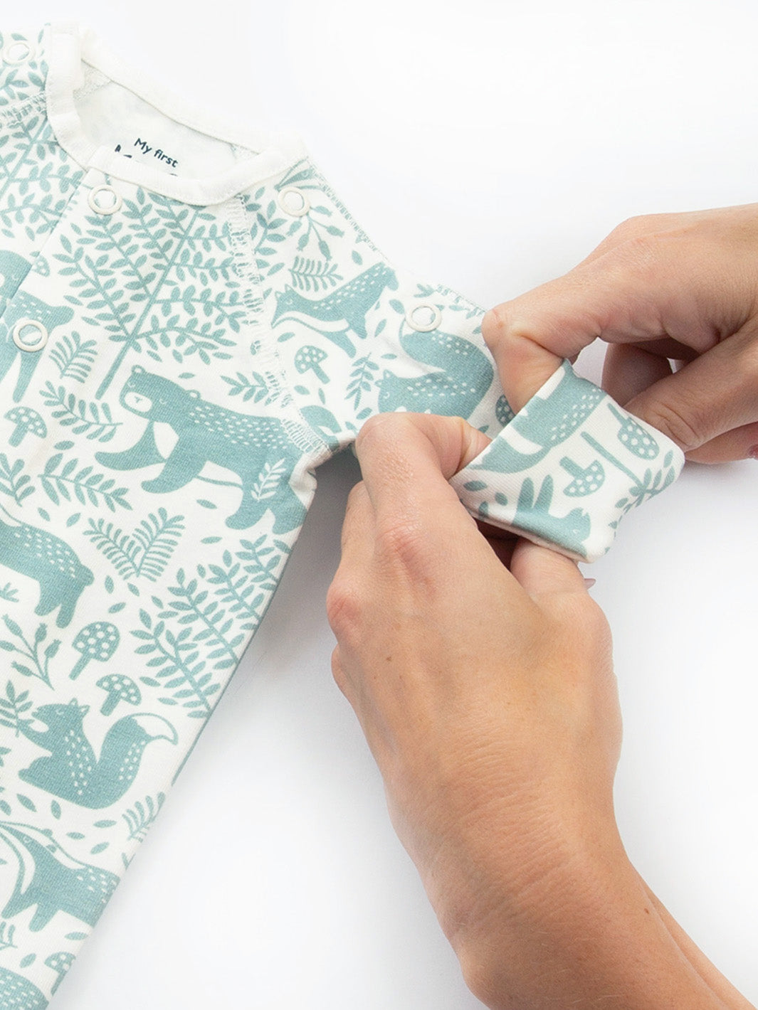 Close‑up on arm cuff of My First Sleepsuit Woodland Walk Green – softly finished cuff designed for tiny babies and premature babies, ideal for early days with babies born too soon