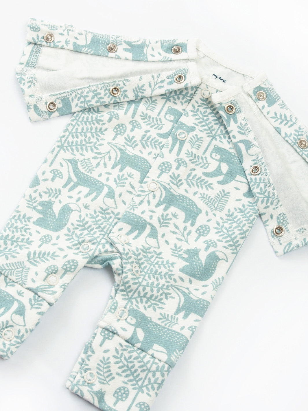 Open arm view of My First Sleepsuit Woodland Walk Green showing easy‑access design – practical preemie baby clothing for premature and early baby arrivals, soft and gentle for tiny babies and babies born too soon