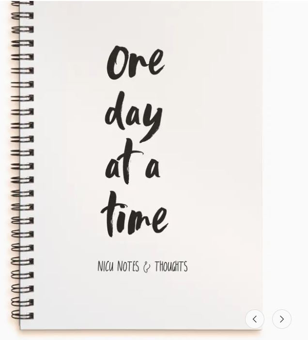 NICU journal with One day at a time text on a white background