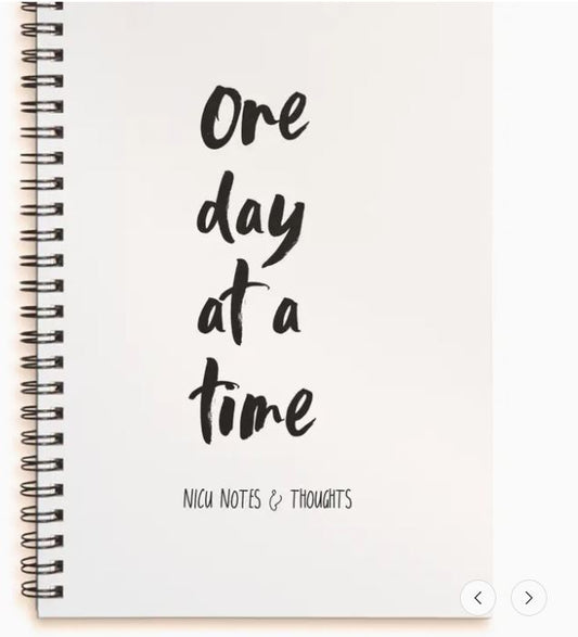 NICU journal with One day at a time text on a white background